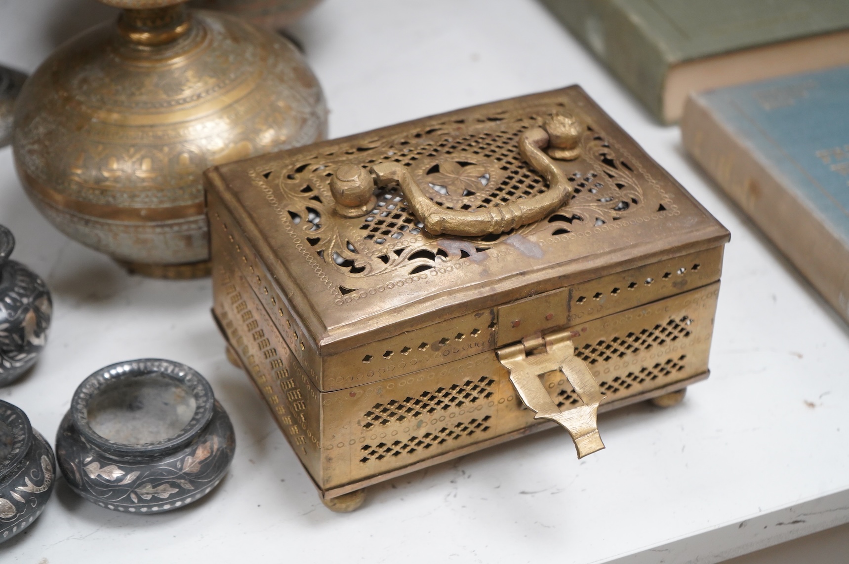 A collection of Indian brass and metalware to include a pierced casket box and Bidriware vases, largest 33cm high